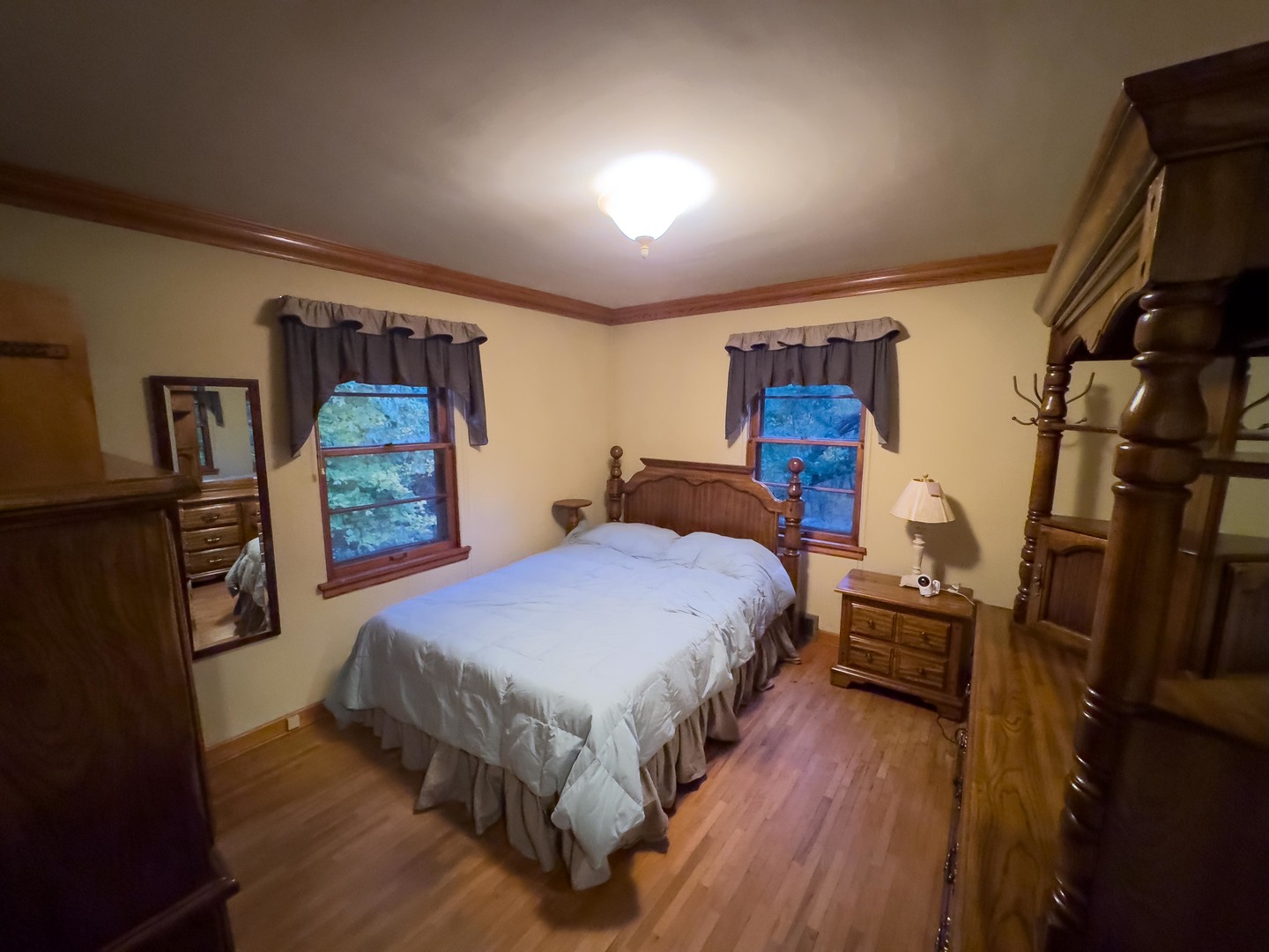19256 1330 E Road Pontiac, IL 61764 - Photo 27 of 36 a bedroom with a bed and a flat tv screen on dresser