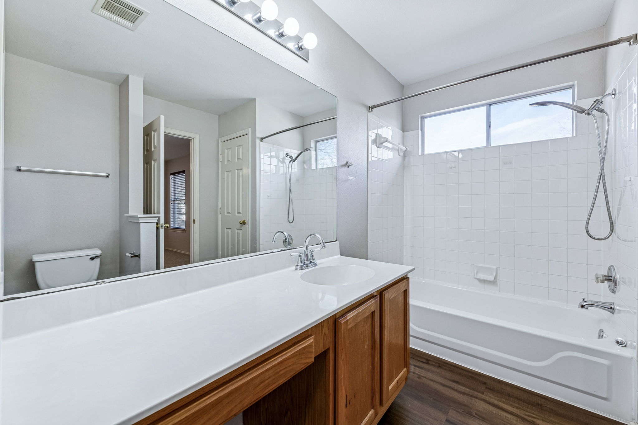 1608 Melibee Trail Austin, TX 78748 - Photo 21 of 29 a bathroom with a tub sink and mirror