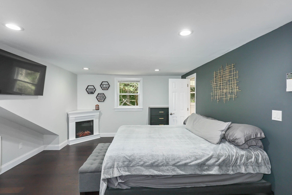 147 Wachusett Street Rutland, MA 01543 - Photo 27 of 41 a bedroom with a bed and a flat screen tv
