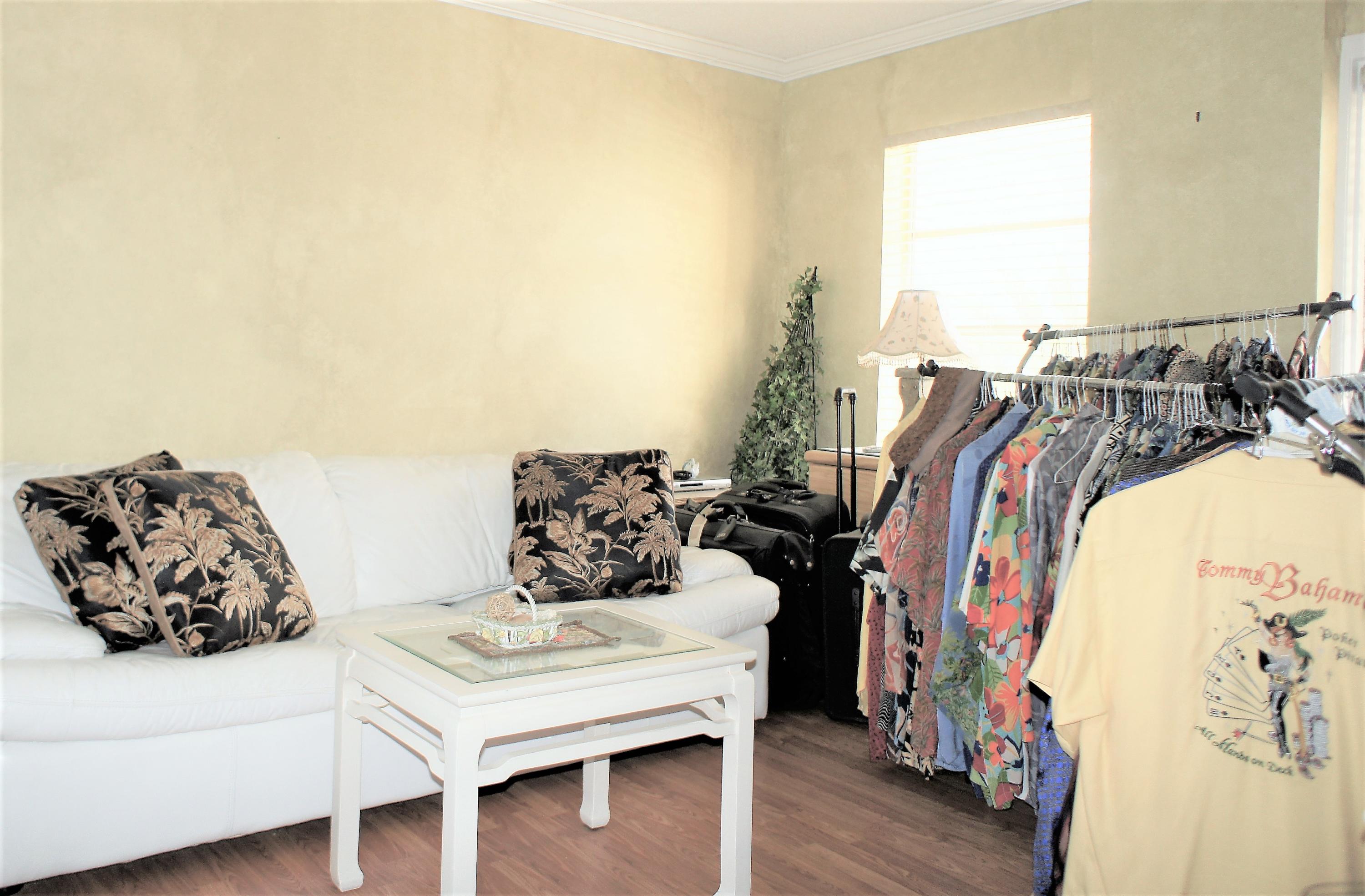 951 De Soto Road, Unit 234 Boca Raton, FL 33432 - Photo 30 of 44 a bed room with a bed and a couch