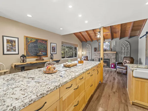 a large kitchen with granite countertop a lot of counter space
