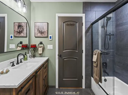 a bathroom with a sink vanity and a mirror