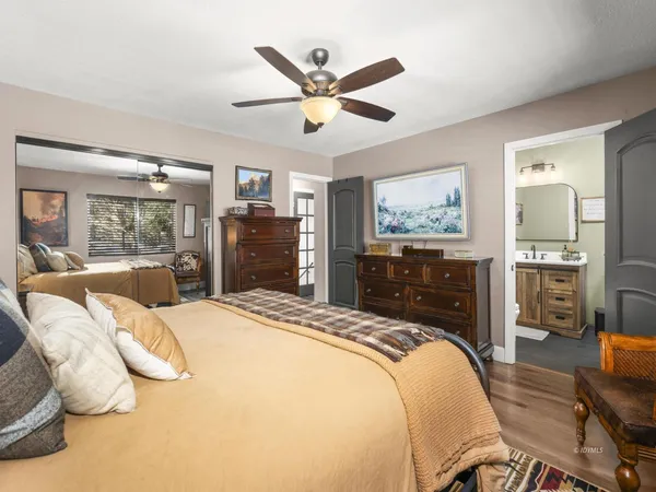 a bed room with a bed and dresser