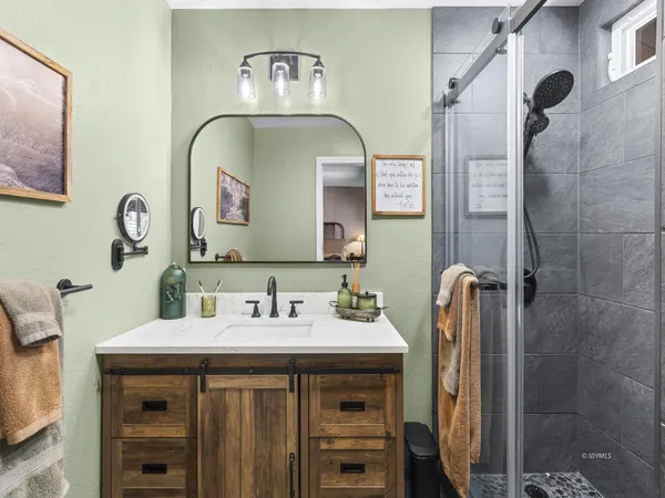 a bathroom with a sink and a mirror