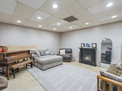 a spacious bedroom with a bed and a fireplace