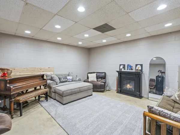 a spacious bedroom with a bed and a fireplace
