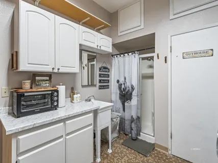 a kitchen with stainless steel appliances a refrigerator sink and cabinets