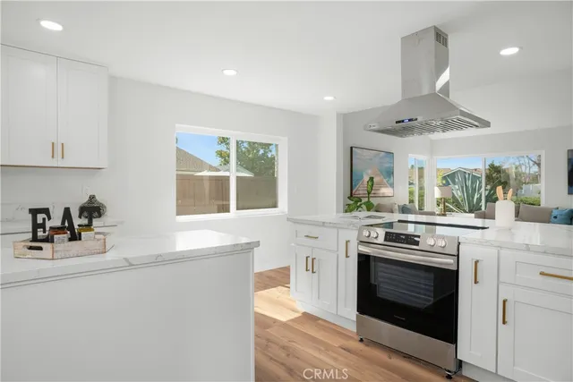 a kitchen with a stove and a sink