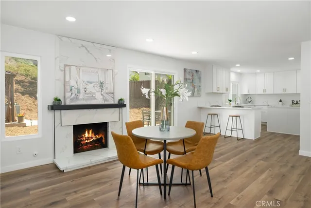 a dining room with furniture and a fireplace