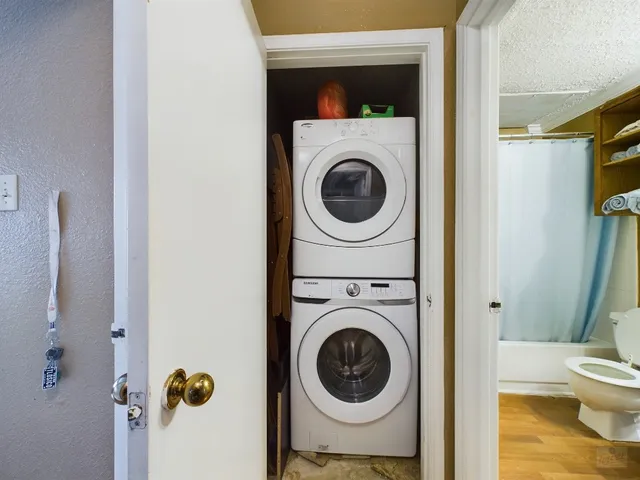 a view of a hallway with washer and dryer