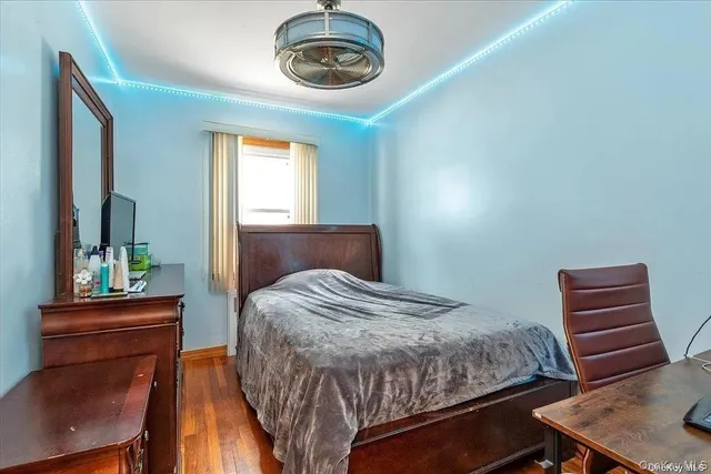 a bedroom with a bed and a chair