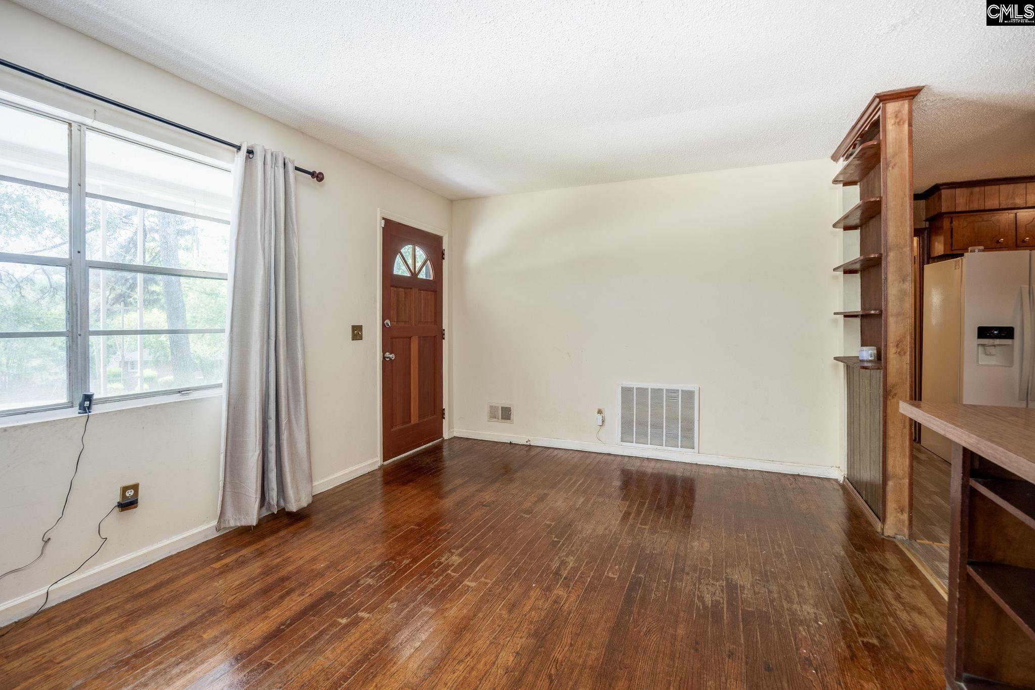 5666 Middleton Court Columbia, SC 29203 - Photo 8 of 42 an empty room with wooden floor cabinet and windows