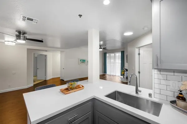 a kitchen with a sink and a refrigerator