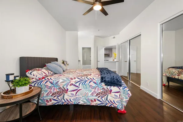 a bedroom with a bed and a dresser