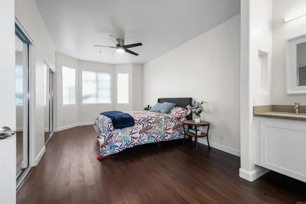 a bedroom with bed and window