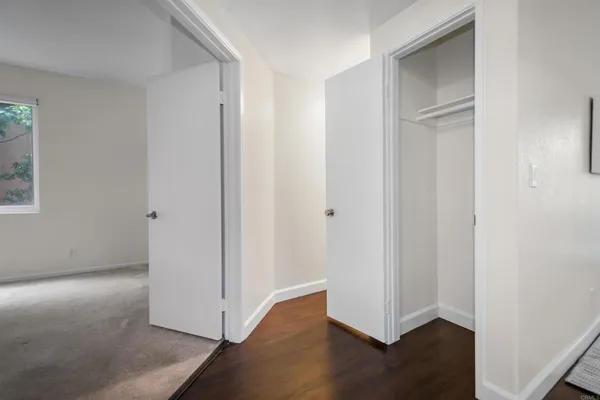 an empty room with wooden floor
