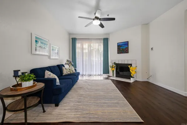 a living room with furniture and a fireplace