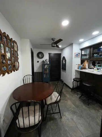 a kitchen with stainless steel appliances granite countertop a sink and a refrigerator