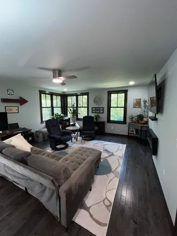 a bed room with furniture and window