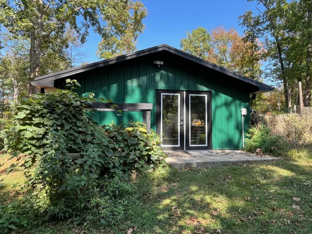 a view of a back yard of the house