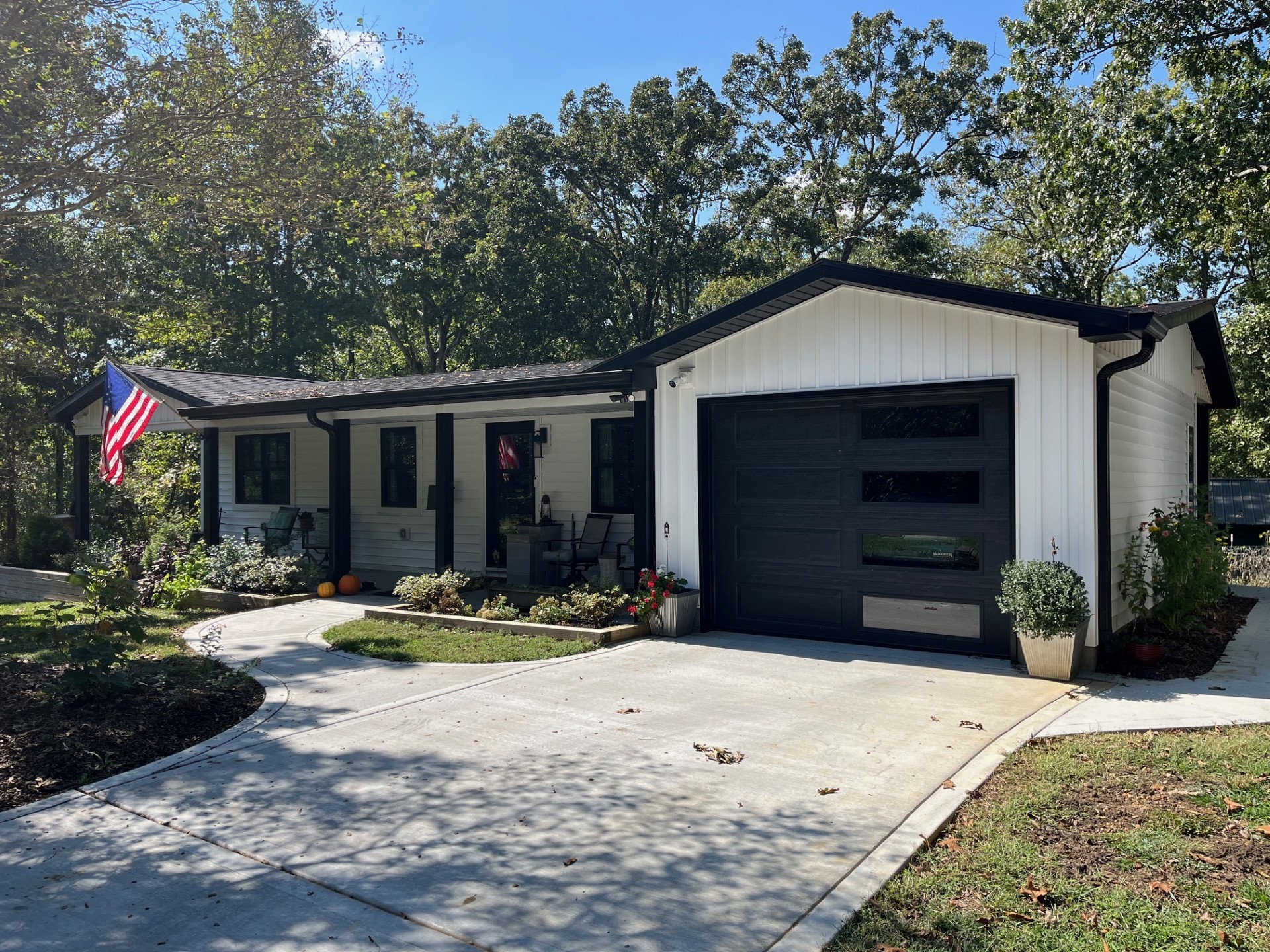 2785 Cypress Road Buchanan, TN 38222 - Photo 3 of 52 a front view of a house with a yard and garage