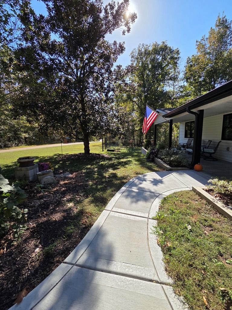 2785 Cypress Road Buchanan, TN 38222 - Photo 46 of 52 a front view of a house with a yard