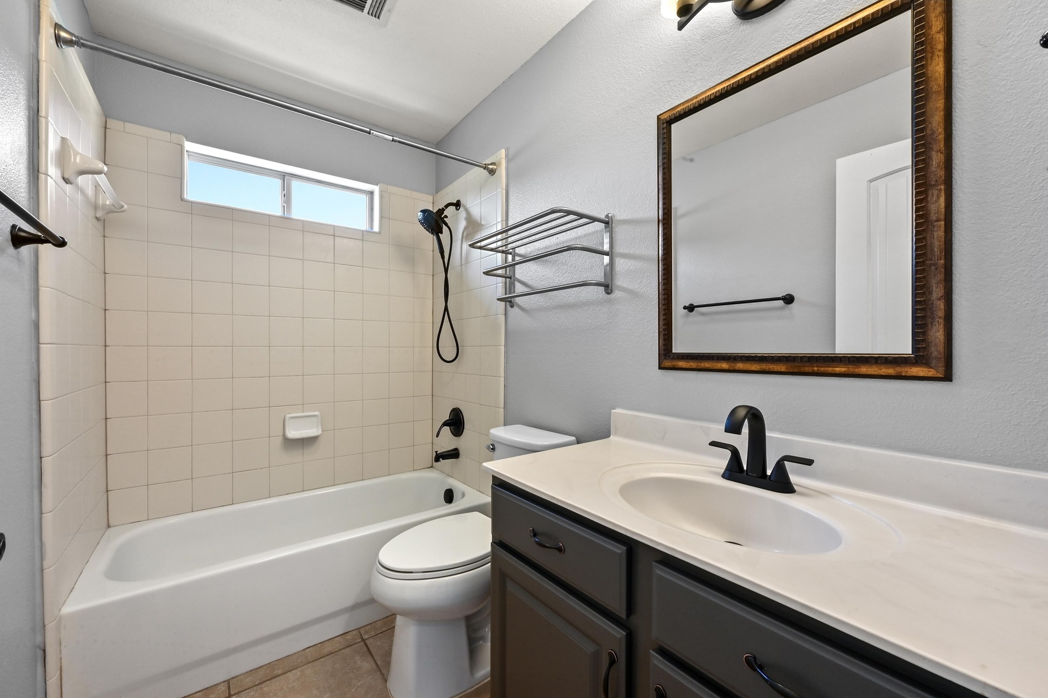 4204 Bob Wire Road Spicewood, TX 78669 - Photo 10 of 25 a bathroom with a sink a toilet and shower