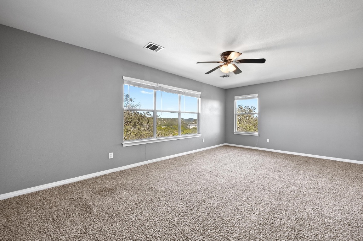 4204 Bob Wire Road Spicewood, TX 78669 - Photo 11 of 24 a view of an empty room with a window