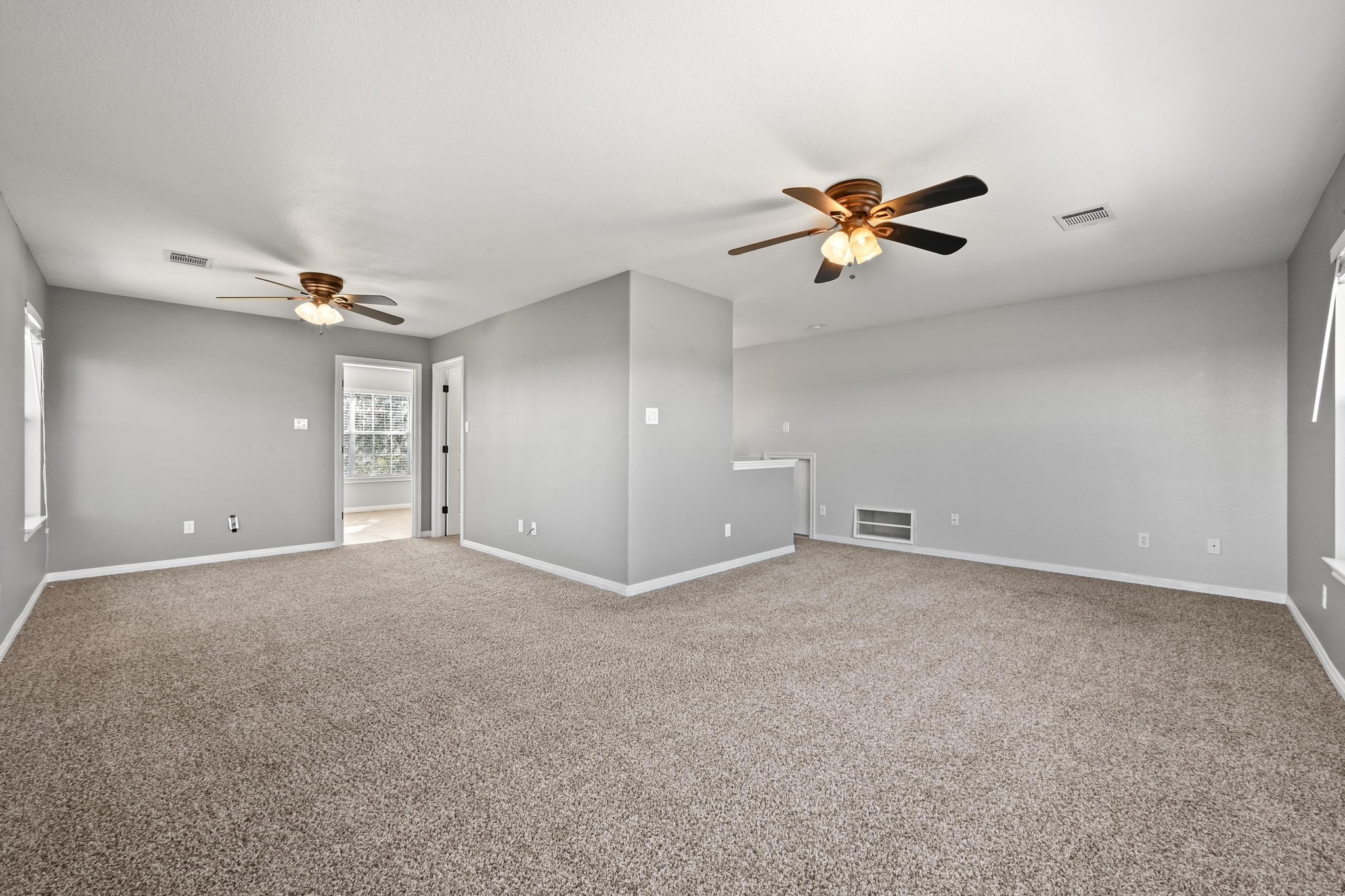 4204 Bob Wire Road Spicewood, TX 78669 - Photo 13 of 25 a view of a big room with ceiling fan