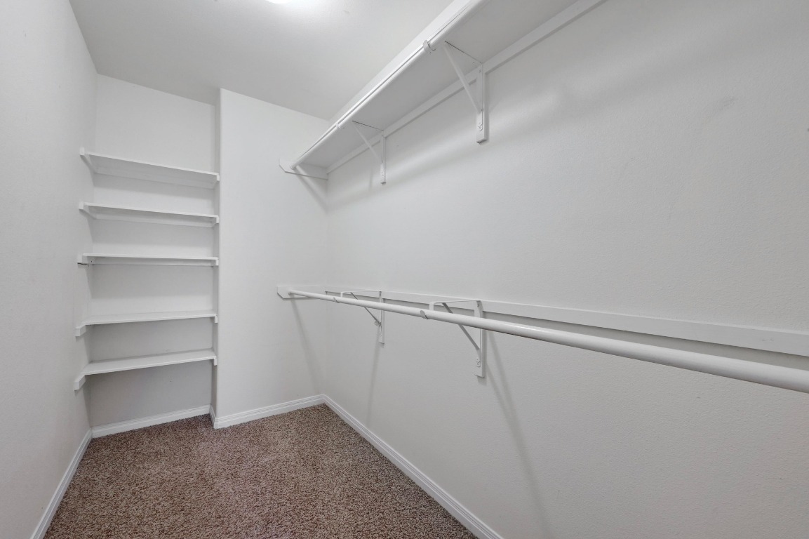 4204 Bob Wire Road Spicewood, TX 78669 - Photo 17 of 24 a view of an empty walk in closet