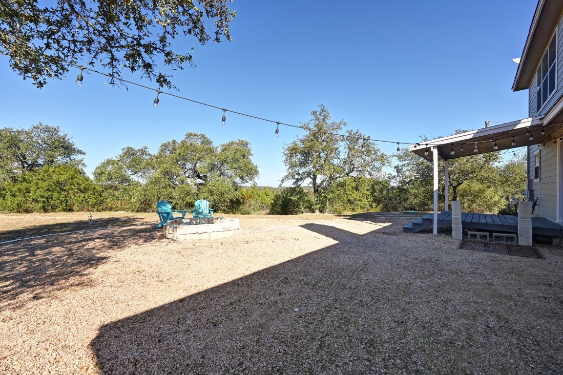 4204 Bob Wire Road Spicewood, TX 78669 - Photo 19 of 24 a view of a backyard of a house