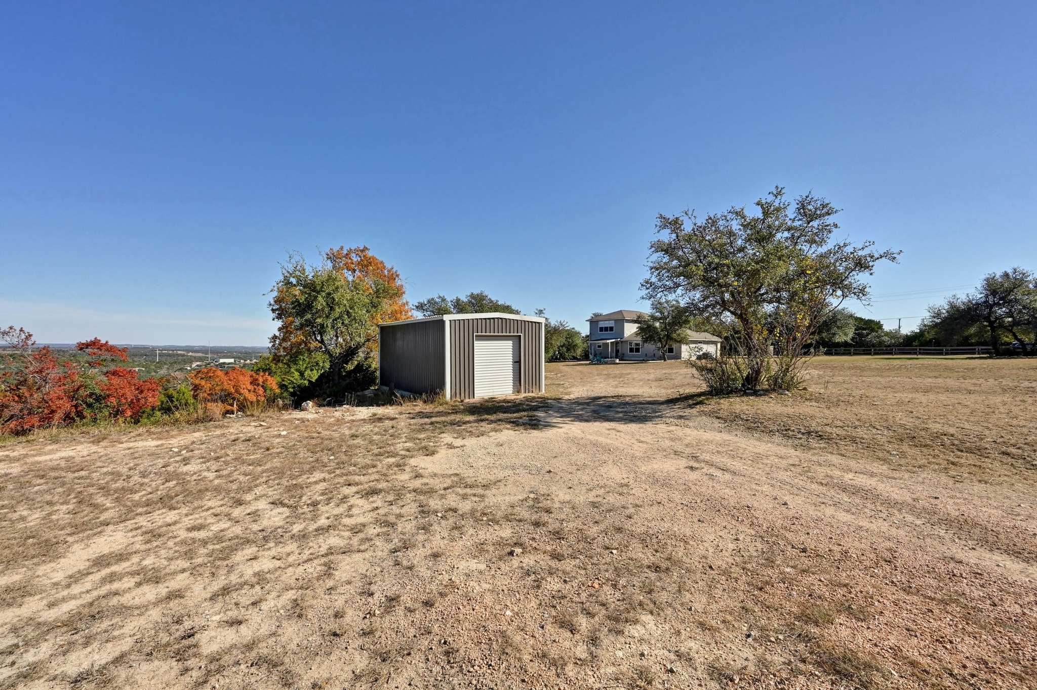 4204 Bob Wire Road Spicewood, TX 78669 - Photo 21 of 25 a pathway with a building in the background