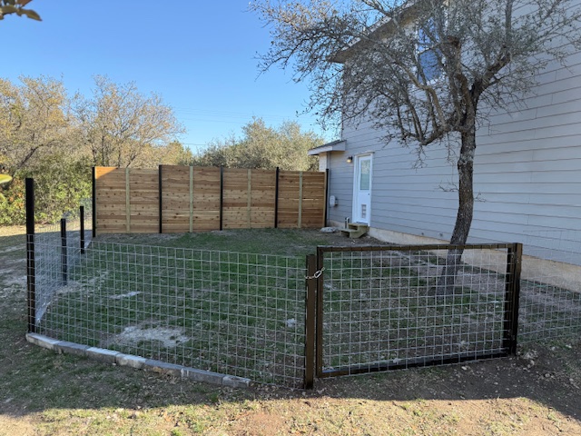 4204 Bob Wire Road Spicewood, TX 78669 - Photo 24 of 25 a view of outdoor space and front view of a house
