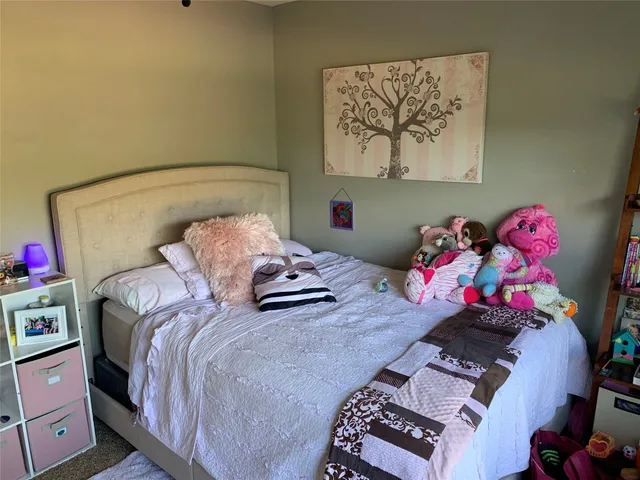 a bedroom with a bed and furniture