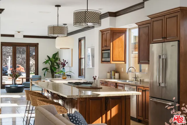 a kitchen with a sink appliances and cabinets
