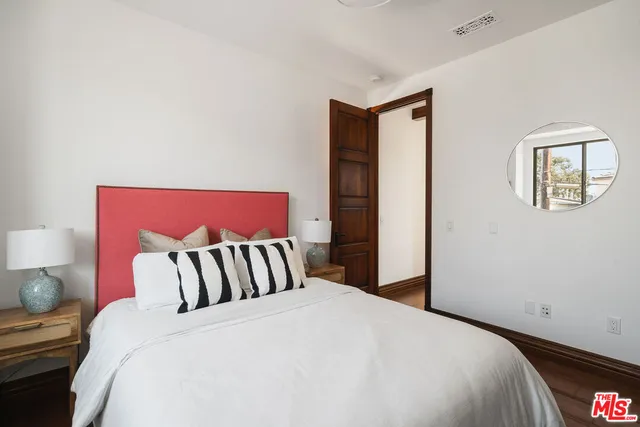 a view of living room with furniture and wooden floor