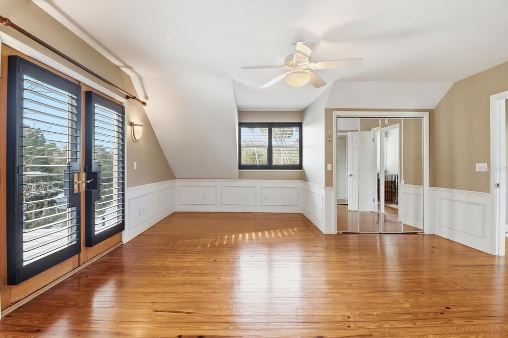 5415 Riverside Drive Yankeetown, FL 34498 - Photo 22 of 45 a view of an empty room with wooden floor and a window