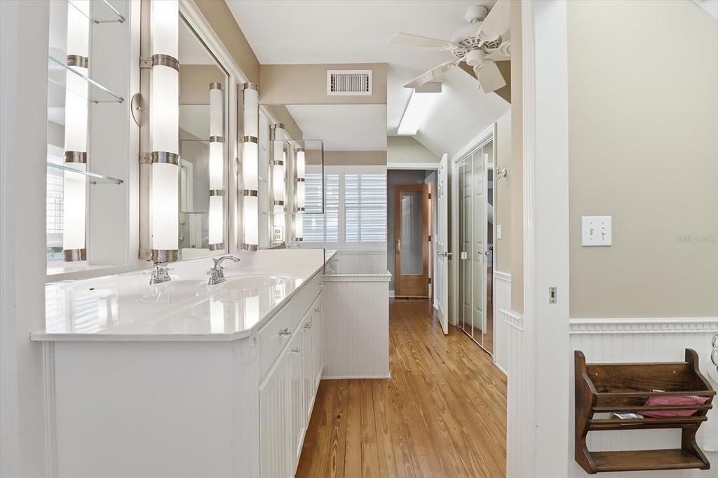 5415 Riverside Drive Yankeetown, FL 34498 - Photo 30 of 45 a spacious bathroom with a double vanity sink and a mirror