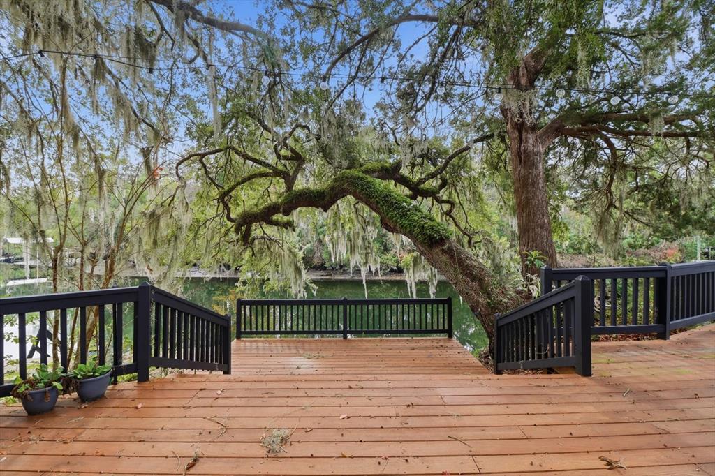 5415 Riverside Drive Yankeetown, FL 34498 - Photo 35 of 45 a view of a wooden deck and trees