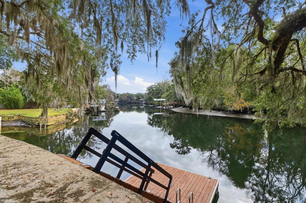 5415 Riverside Drive Yankeetown, FL 34498 - Photo 39 of 45 a view of a lake with a bench