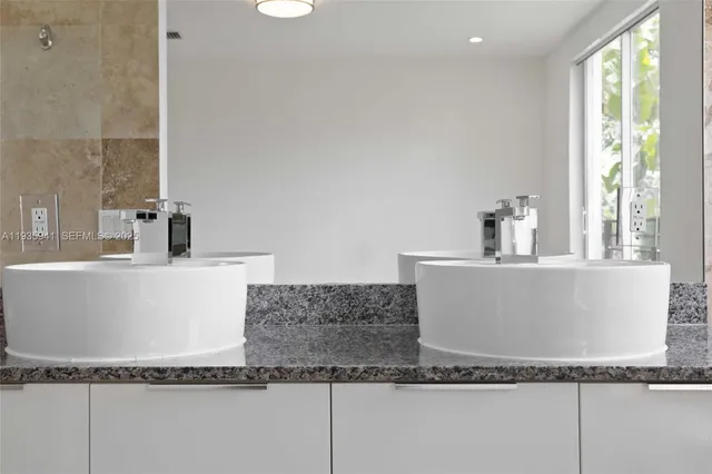 a bathroom with a toilet sink and shower