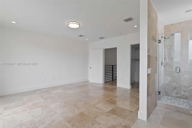 a view of a kitchen with kitchen island and a sink