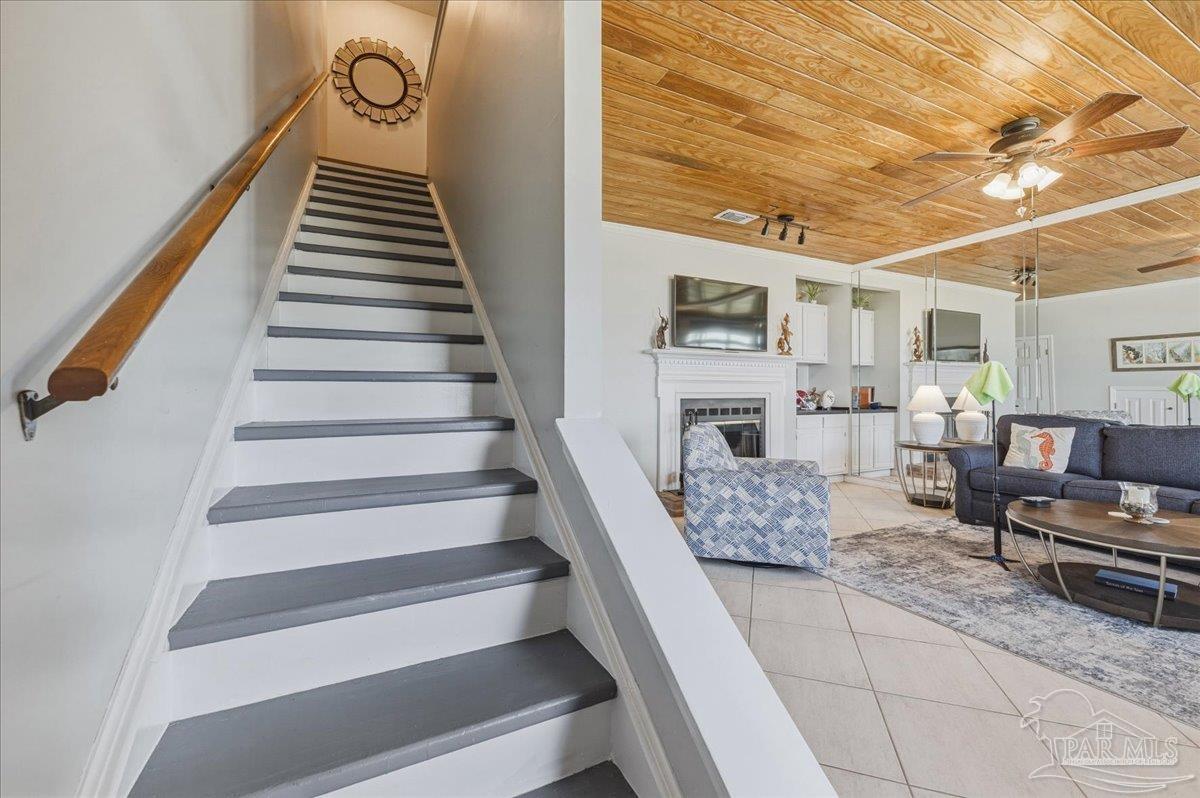26063 Canal Road, Unit 3F Orange Beach, AL 36561 - Photo 41 of 72 a living room with furniture and a fireplace