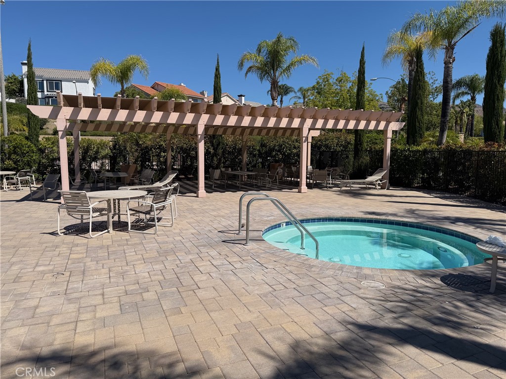 19823 Mariposa Pines Way Porter Ranch, CA 91326 - Photo 41 of 50 a view of a swimming pool with a patio