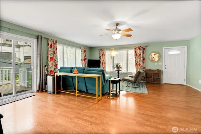 a living room with furniture and a flat screen tv