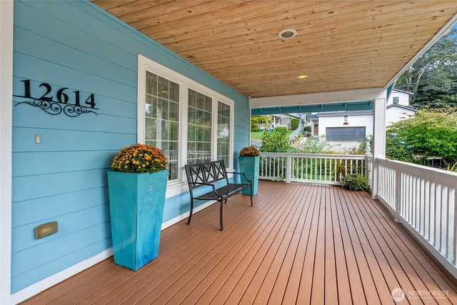 a view of a deck with wooden floor and seating space