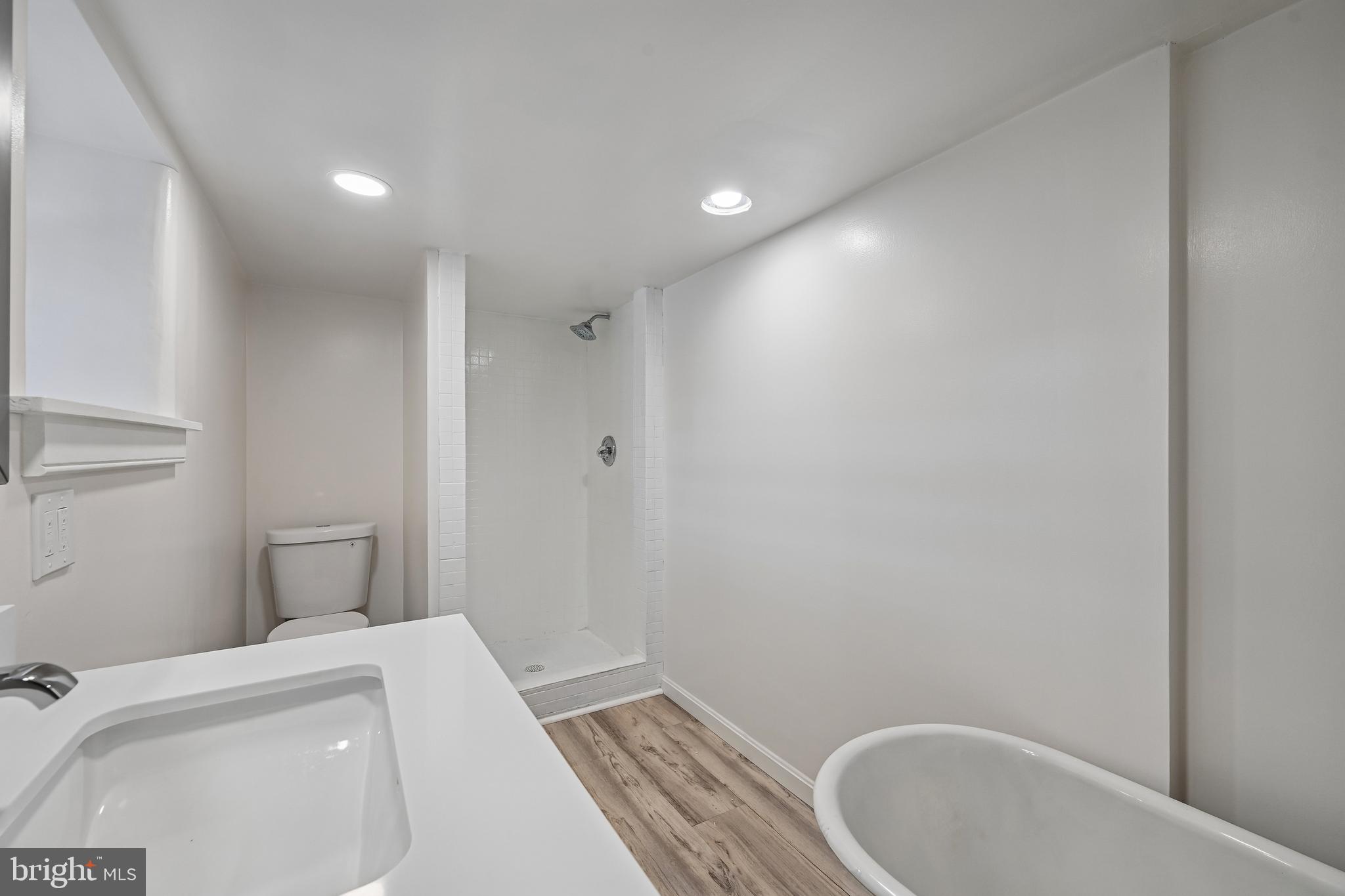 5702 Falls Road Baltimore, MD 21209 - Photo 22 of 49 a bathroom with a toilet and a sink