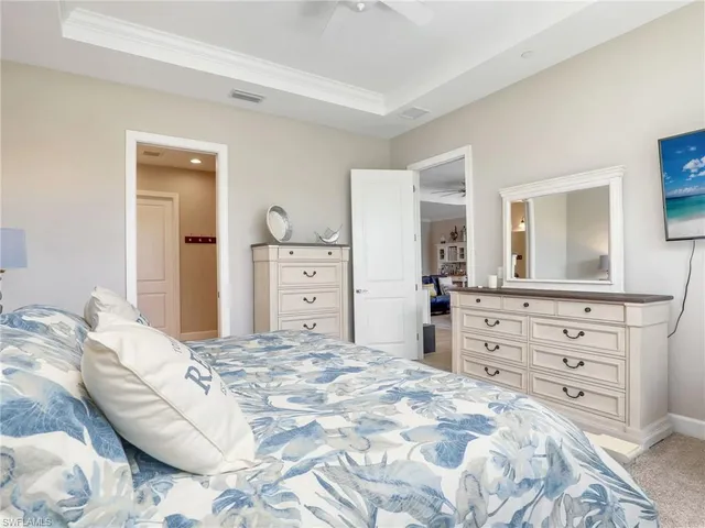 a spacious bathroom with a granite countertop sink and a mirror