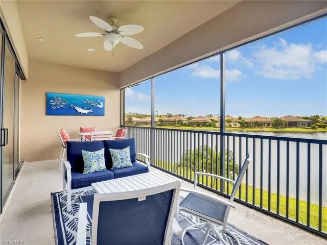 a view of a balcony with furniture