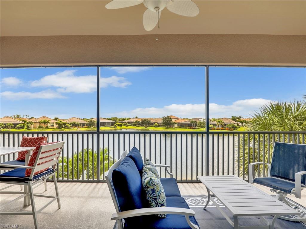 9685 Montelanico Loop, Unit 202 Naples, FL 34119 - Photo 30 of 41 a balcony with table and chairs